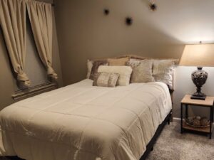 A cozy bedroom with minimalist grey finish