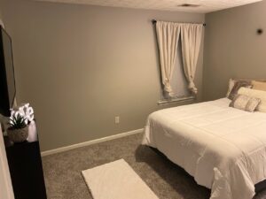 A cozy bedroom with minimalist grey finish