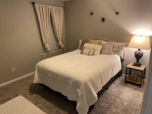 A cozy bedroom with minimalist grey finish