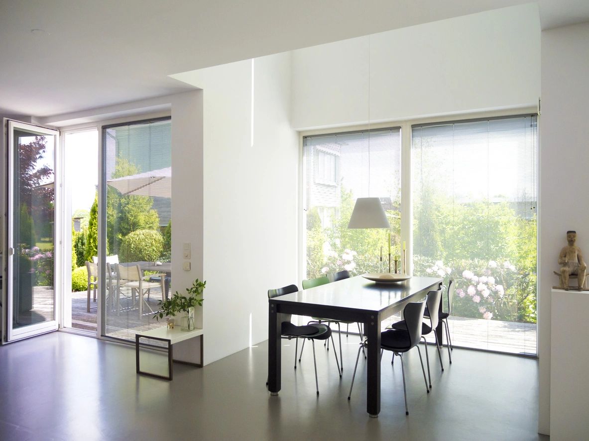 A simple luxurious dining area with wide mirror window